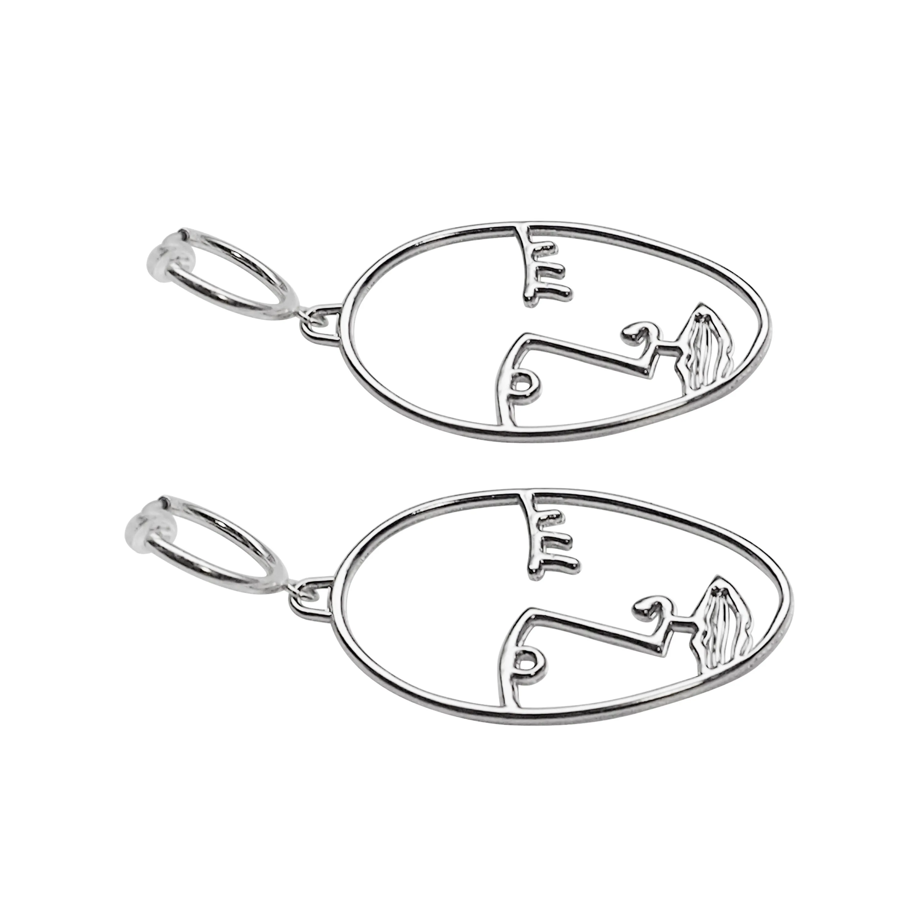 Silver Picasso human face clip on hoop earrings